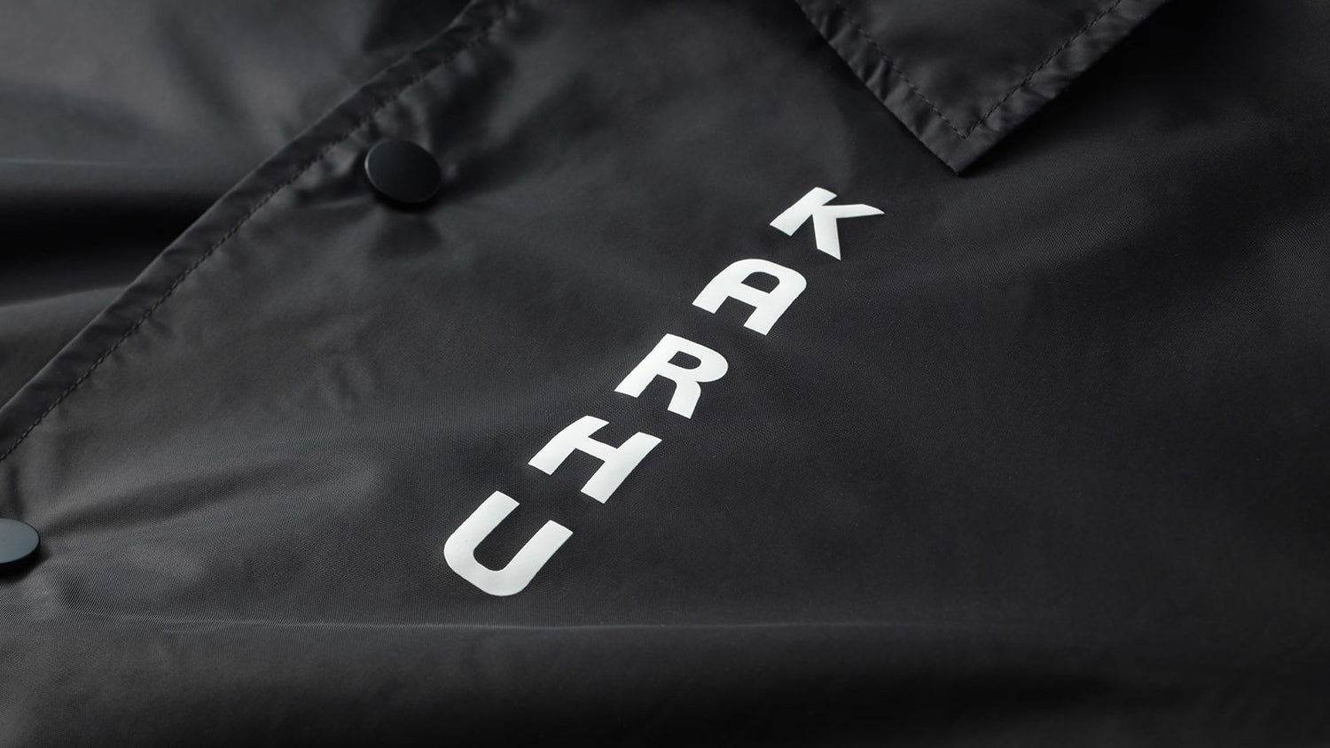 worldwide-coach-jacket-black-SPELLOUT-back